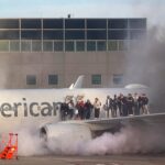 US Airlines Fires on the runway by running passengers via wings